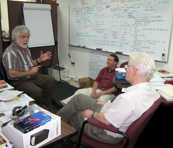 Photo of Carl Ingalls, Paul Bunn, and Jacques Werth brainstorming about HPS